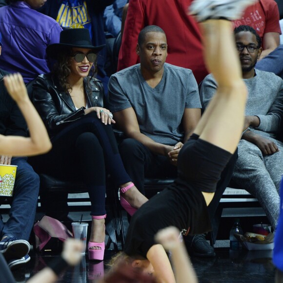 Beyoncé, Jay-Z, et Kendrick Lamar au Staples Center de Los Angeles lors de la rencontre entre les Clippers de Los Angeles et les Warriors de Golden State, le 20 février 2016