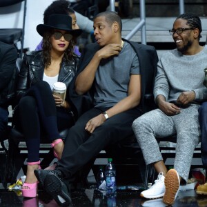 Beyoncé, Jay-Z, et Kendrick Lamar au Staples Center de Los Angeles lors de la rencontre entre les Clippers de Los Angeles et les Warriors de Golden State, le 20 février 2016