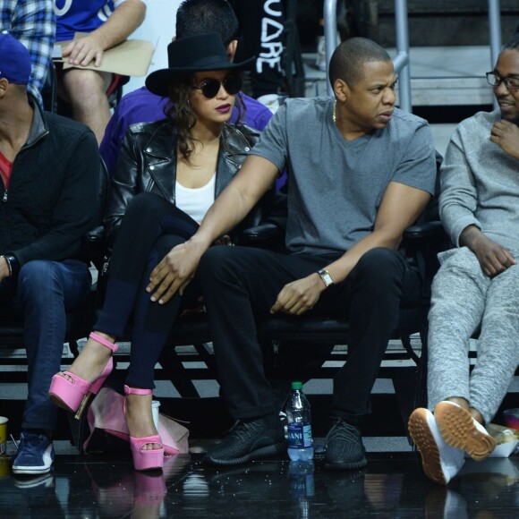 Beyoncé, Jay-Z, et Kendrick Lamar au Staples Center de Los Angeles lors de la rencontre entre les Clippers de Los Angeles et les Warriors de Golden State, le 20 février 2016