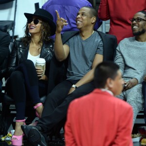 Beyoncé, Jay-Z, et Kendrick Lamar au Staples Center de Los Angeles lors de la rencontre entre les Clippers de Los Angeles et les Warriors de Golden State, le 20 février 2016