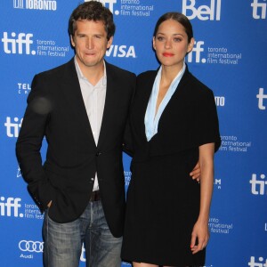 Marion Cotillard (habillee en Dior Haute Couture) et Guillaume Canet - Conference de Presse du film "Bood Ties" lors du Festival International du Film de Toronto, le 10 septembre 2013.