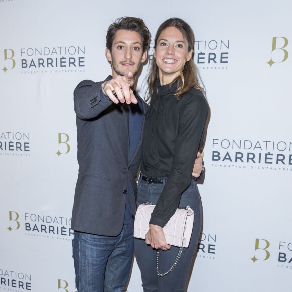 Pierre Niney et sa compagne Natasha Andrews - Avant Première du film "Five" prix cinéma 2016 de la Fondation Barrière à Paris le 14 mars 2016. © Olivier Borde/Bestimage