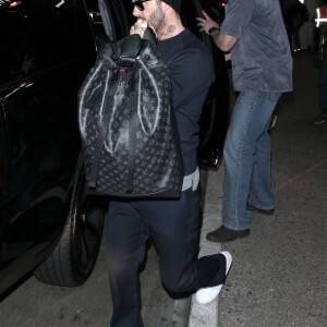 David Beckham et ses enfants Brooklyn, Romeo, Cruz et Harper arrivent à l'aéroport LAX de Los Angeles, le 24 mars 2016.