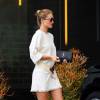 Exclusif - Rosie Huntington-Whiteley à West Hollywood, porte une robe blanche en bourette soie Isabel Marant Étoile (modèle Harry) et des chaussures en daim Gianvito Rossi (modèle Brooklyn). Des lunettes de soleil Jimmy Choo et un sac Saint Laurent accessoirisent sa tenue. Le 29 mars 2016.