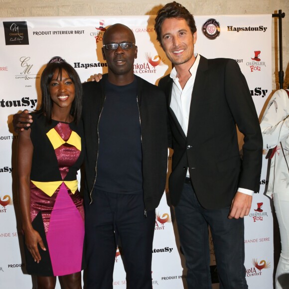 Lilian Thuram entre Hapsatou Sy et son compagnon Vincent Cerutti - Inauguration du showroom d'Hapsatou Sy au Viaduc des Arts à Paris, le 14 janvier 2016. © CVS/Bestimage