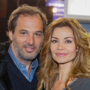 Ingrid Chauvin et son mari Thierry Peythieu au salon du livre à la porte de Versailles à Paris le 22 mars 2015.