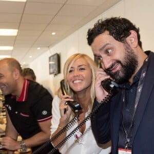 Cyril Hanouna et Enora Malagré - 11ème édition du "BGC Charity Day" à Paris le 11 septembre 2015 en mémoire aux 658 collaborateurs du groupe BGC partners (leader mondial du courtage interbancaire) disparus il y a 14 ans dans les attentats du World Trade Center le 11 septembre 2001. Les people sont courtier d'un jour pour encourager les clients à passer ce jour là le maximum d'ordres dans la salle des marchés d'Aurel BGC au 62, rue de Richelieu 75002 Paris. Chaque 11 septembre , la totalité du chiffre d'affaire réalisé par le groupe sera reversée à des associations.