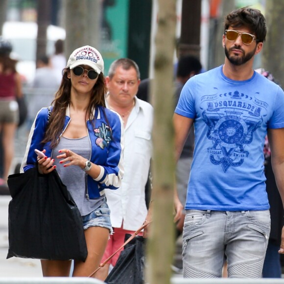 Exclusif - Nabilla Benattia et son compagnon Thomas Vergara déjeunent chez "Pizza Pino" sur les Champs Elysées et vont faire du shopping sur l'Avenue Montaigne avec leur chien Pita à Paris, France, le 21 juillet 2016. © Agence/Bestimage