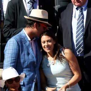 Marion Bartoli et son compagnon dans les tribunes lors de la finale des Internationaux de tennis de Roland-Garros à Paris, le 6 juin 2015.