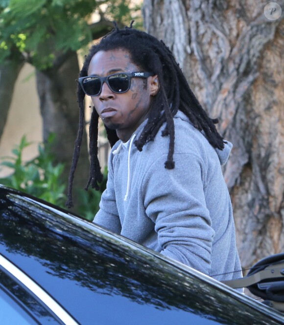 Exclusif - Le rappeur Lil Wayne à l'arrière d'une Maybach décapotable à Hollywood, le 8 juillet 2014.