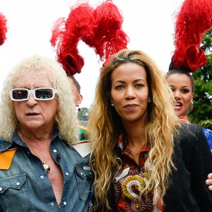Michel Polnareff, sa compagne Danyellah et leur fils Louka - Le chanteur français Michel Polnareff fête son 72ème anniversaire en présence des danseuses du Moulin-Rouge et donne le départ de la deuxième étape de la 103ème édition de la course cycliste du tour de France le 3 Juillet 2016, entre Saint-Lo et Cherbourg-en-Cotentin, en Normandie. © Coadic Guirec