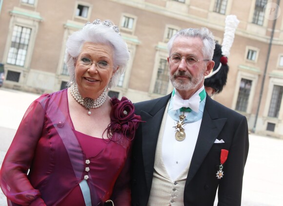 La princesse Christina de Suède et son époux Tord Magnuson au mariage de Carl Philip de Suède et Sofia Hellqvist à la chapelle du palais royal à Stockholm le 13 juin 2015