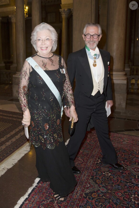 La princesse Christina de Suède et son mari Tord Magnuson arrivent à un dîner officiel au Palais Royal de Stockholm, le 11 février 2015.