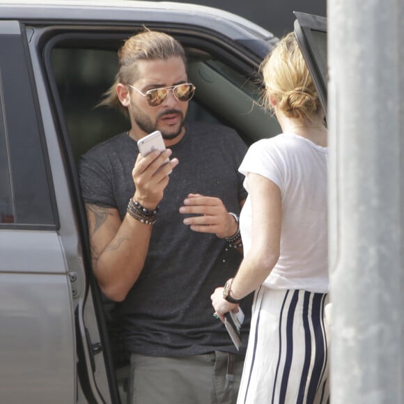 Dennis Papageorgiou dépose en voiture sa compagne Lindsay Lohan à l'aéroport international d’Athènes en Grèce, le 11 septembre 2016