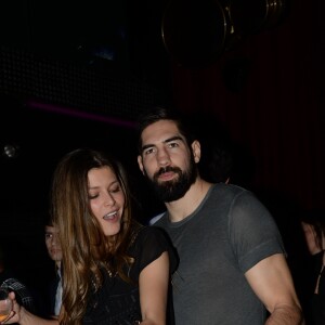 Nikola Karabatic et sa compagne Géraldine Pillet - Les champions du monde de handball fêtent leur victoire au VIP Room à Paris le 2 février 2015.