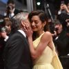 George Clooney et sa femme Amal Alamuddin Clooney (bijoux Cartier) - Descente des marches du film "Money Monster" lors du 69e Festival International du Film de Cannes. Le 12 mai 2016. © Giancarlo Gorassini/Bestimage