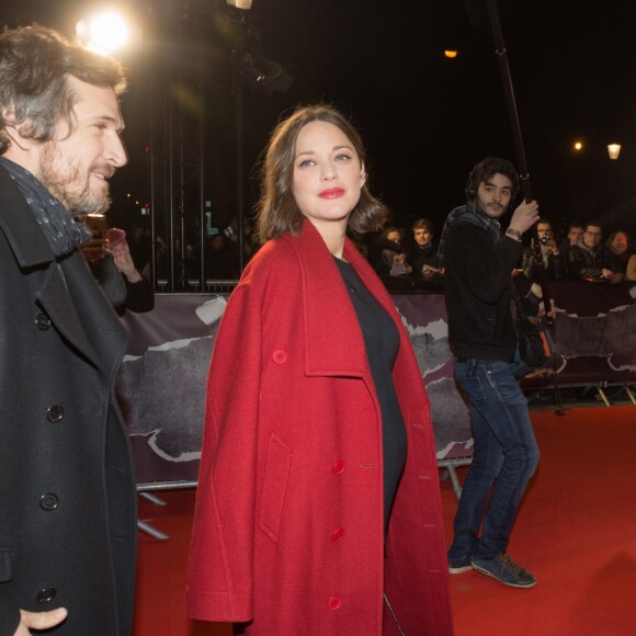 Guillaume Canet et sa compagne Marion Cotillard enceinte arrivent à l'avant-première du film "Rock'n Roll" au Pathé Beaugrenelle à Paris le 13 février 2017.