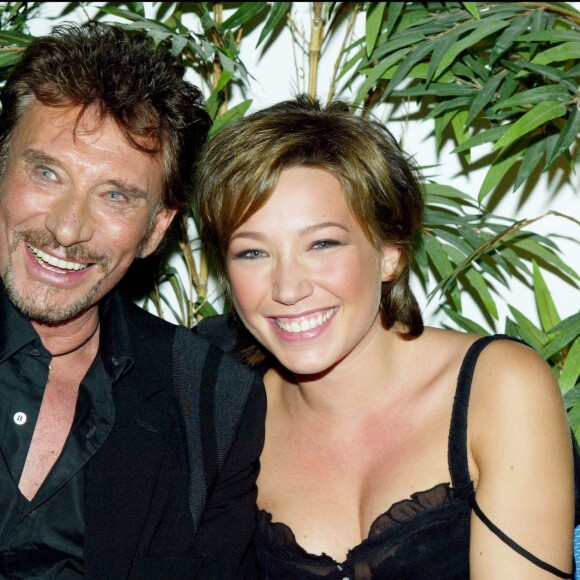 Johnny Hallyday et Laura Smet lors de la soirée d'inauguration de l'Amnésia, le 1er octobre 2003.