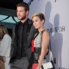 Liam Hemsworth et Miley Cyrus - Première du film "Paranoia" à Los Angeles, le 8 aout 2013.