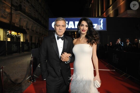 Exclusif - George Clooney et sa femme Amal Alamuddin-Clooney (enceinte) - 42ème cérémonie des Cesar à la salle Pleyel à Paris, le 24 février 2017.