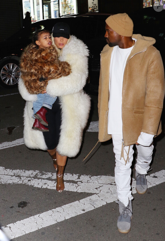 Kim Kardashian, son mari Kanye West et leur fille North à New York le 14 février 2016.