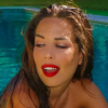 Kim des Marseillais sexy dans sa piscine, le 25 juillet 2016.