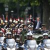 Emmanuel Macron (costume "Jonas & Cie" (rue d'Aboukir à Paris) à 450 Euros) salue les français sur l'avenue des Champs Elysées à Paris le 14 Mai 2017.