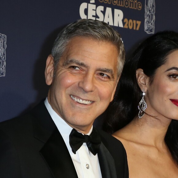 George Clooney (montre Omega) et sa femme Amal Alamuddin-Clooney (enceinte) arrivant à la 42e cérémonie des César à la Salle Pleyel à Paris le 24 février 2017. © Olivier Borde / Dominique Jacovides / Bestimage