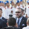 Le président français Emmanuel Macron et le roi Mohammed VI du Maroc devant une haie d'honneur de la garde royale - Le couple présidentiel est arrivé à l'aéroport international de Rabat-Salé pour son premier voyage offi­ciel au Maroc, le 14 juin 2017. © Pierre Perusseau/Bestimage