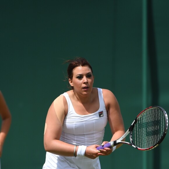 Marion Bartoli participe au tournoi des légendes de Wimbledon, Londres, le 12 juillet 2017.