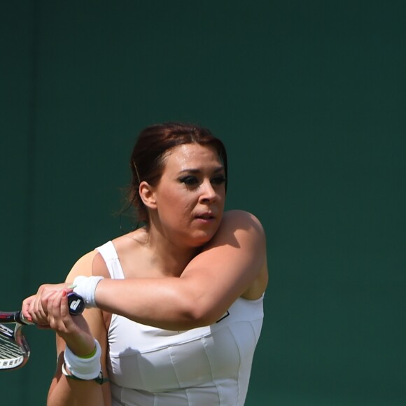 Marion Bartoli participe au tournoi des légendes de Wimbledon, Londres, le 12 juillet 2017.