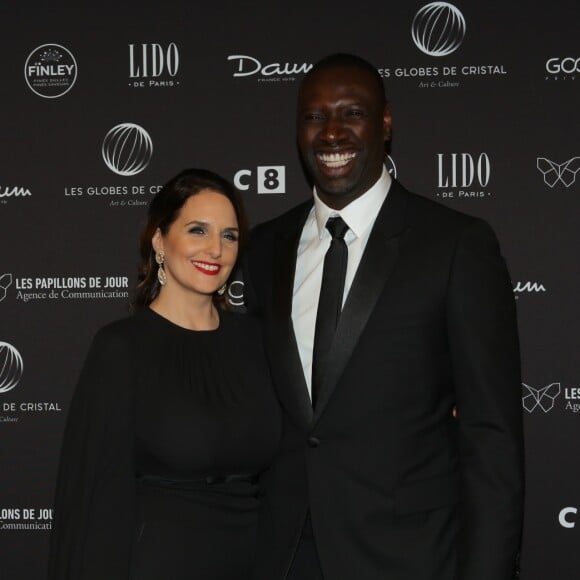 Omar Sy et sa femme Hélène au photocall de la 11ème cérémonie des Globes de Cristal au Lido à Paris le 30 janvier 2017. © CVS / Bestimage