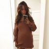Amel Bent publie un photo en cuissardes, le ventre arrondi, sur sa page Instagram le 3 octobre 2017.