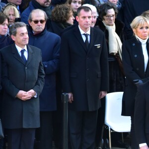 Carla Bruni-Sarkosy, Nicolas Sarkozy, la première dame Brigitte Macron, le président Emmanuel Macron lors de la cérémonie d'hommage national à Jean d'Ormesson à l'hôtel des Invalides à Paris le 8 décembre 2017. © Giancarlo Gorassini / Bestimage