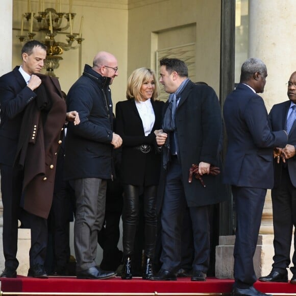 Charles Michel, Brigitte Macron (Trogneux), Xavier Bettel - Le président Emmanuel Macron quitte le palais de l'Elysée avec les chefs d'état du One Planet Summit pour rejoindre un bateau au Pont Alexandre III à Paris le 12 décembre 2017. © Pierre Perusseau / Bestimage