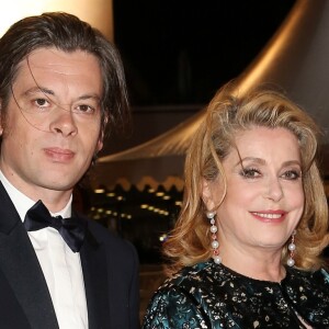 Benjamin Biolay et Catherine Deneuve - 67e Festival de Cannes, le 21 mai 2014.