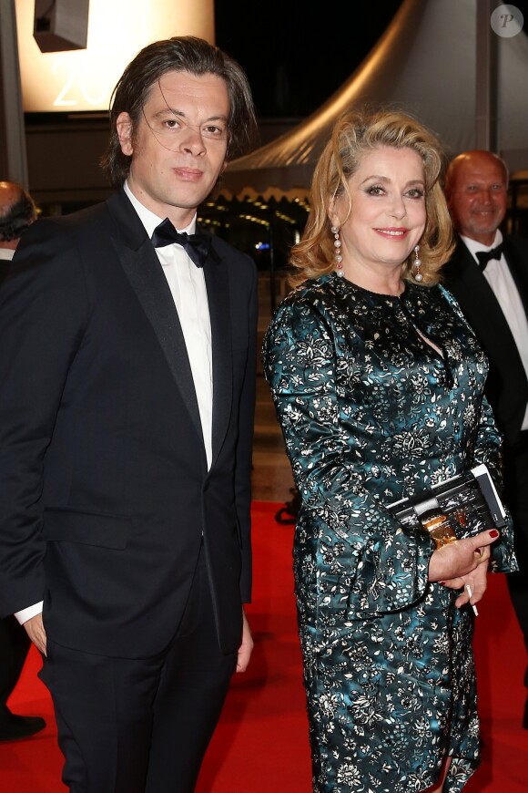 Benjamin Biolay et Catherine Deneuve - 67e Festival de Cannes, le 21 mai 2014.