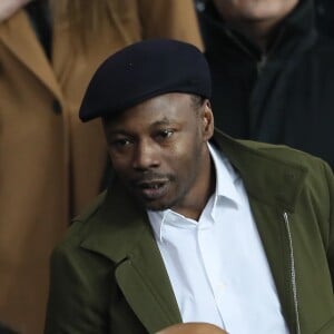 MC Solaar (Claude M'Barali) dans les tribunes du Parc des Princes lors du match de Ligue 1 PSG - OM (3-0), à Paris le 25 février 2018.