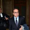 Faouzi Lamdaoui, ancien conseiller de François Hollande arrive avec son avocat Ardavan Amir-Aslani pour son procès pour abus de biens sociaux (en 2007 et 2008) au tribunal correctionnel au palais de justice de Paris, le 5 octobre 2015.