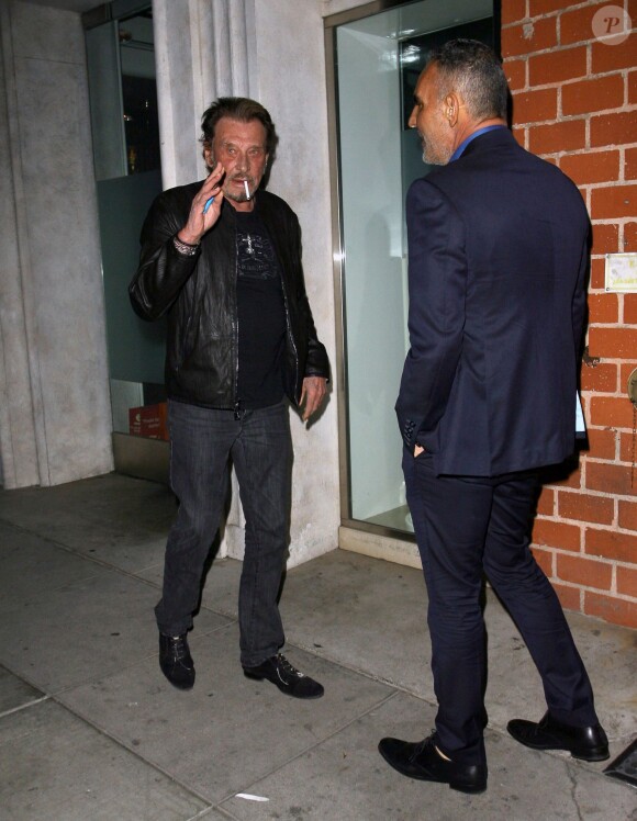 Johnny Hallyday et sa femme Laeticia sont allés dîner avec Christian Audigier et sa fiancée Nathalie Sorensen au restaurant Mr Chow à Los Angeles le 23 janvier 2015.23/01/2015 - Los Angeles
