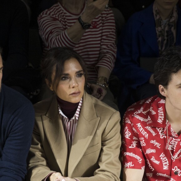 David et Victoria Beckham avec leur fils Brooklyn - Front row du défilé de mode " Louis Vuitton " Hommes Automne-Hiver 2018 au Palais Royal à Paris. Le 18 janvier 2018 © Olivier Borde / Bestimage