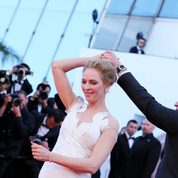Quentin Tarantino (montre Montblanc Timewalker) et Uma Thurman - Montée des marches du film "Pour une poignée de dollars" pour la cérémonie de clôture du 67e Festival du film de Cannes le 24 mai 2014