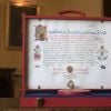Le document du consentement formel de la reine Elizabeth II pour le mariage du prince Harry et de Meghan Markle a été révélé le 12 mai 2018 à Buckingham Palace, à Londres, une semaine jour pour jour avant la cérémonie.