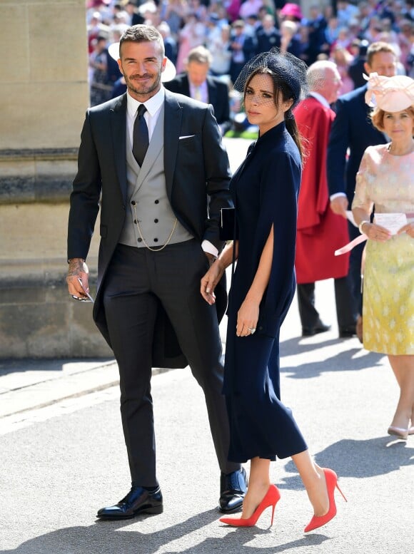 David Beckham et sa femme Victoria arrivent à la chapelle St George pour le mariage du prince Harry et de Meghan Markle au château de Windsor, Royaume Uni, le 19 mai 2018.