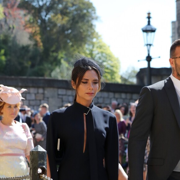David Beckham et sa femme Victoria arrivent à la chapelle St George pour le mariage du prince Harry et de Meghan Markle au château de Windsor, Royaume Uni, le 19 mai 2018.