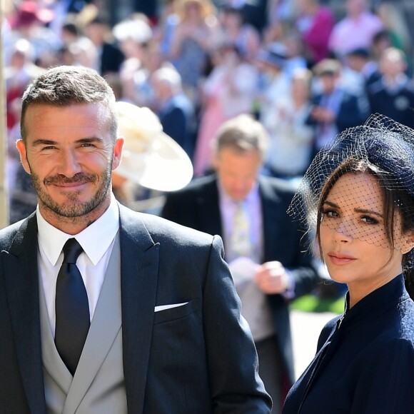 David Beckham et sa femme Victoria arrivent à la chapelle St George pour le mariage du prince Harry et de Meghan Markle au château de Windsor, Royaume Uni, le 19 mai 2018.