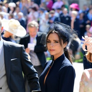 David Beckham et sa femme Victoria arrivent à la chapelle St George pour le mariage du prince Harry et de Meghan Markle au château de Windsor, Royaume Uni, le 19 mai 2018.