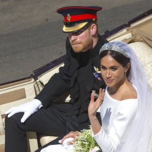 Le prince Harry, duc de Sussex, et Meghan Markle, duchesse de Sussex, en calèche au château de Windsor après la cérémonie de leur mariage au château de Windsor, Royaume Uni, le 19 mai 2018.