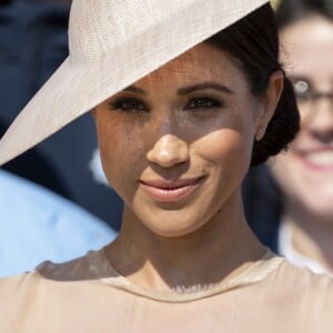 Meghan Markle, duchesse de Sussex, avec le prince Harry lors d'une garden party en l'honneur du prince Charles au palais de Buckingham à Londres le 22 mai 2018, trois jours après leur mariage.