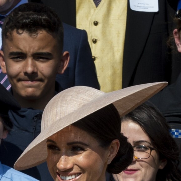 Meghan Markle, duchesse de Sussex, avec le prince Harry lors d'une garden party en l'honneur du prince Charles au palais de Buckingham à Londres le 22 mai 2018, trois jours après leur mariage.